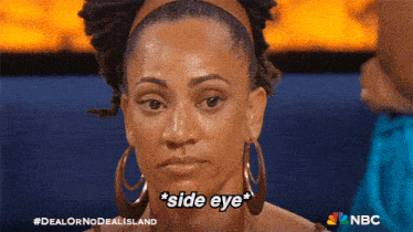 a woman wearing hoop earrings says " side eye "