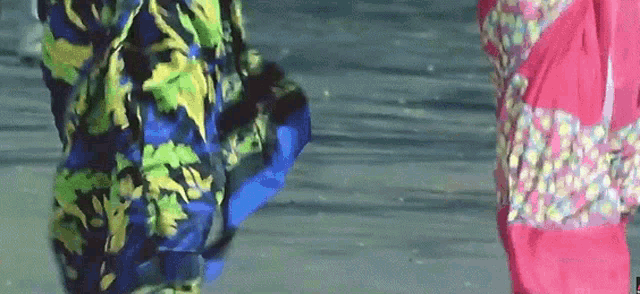 a person wearing a colorful jacket is walking