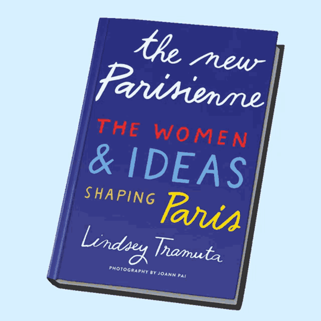 a blue book titled the new parisienne the women & ideas shaping paris by lindsey tramuta