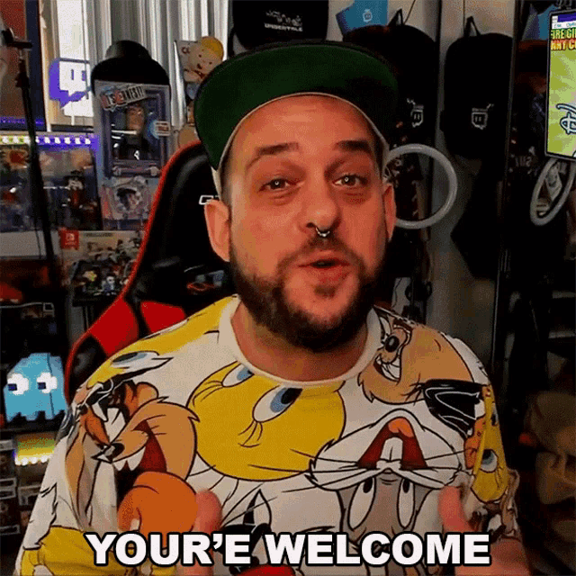 a man in a looney tunes shirt says your e welcome