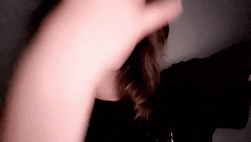 a close up of a person 's face with a blurry background