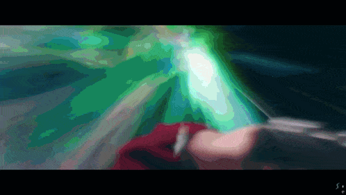 a blurry image of a person holding a sword with a green light behind them