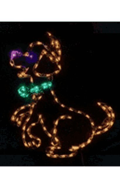 a santa hat made of lights is lit up in red and white