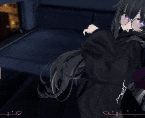 a girl in a black hoodie is laying on a couch in a dark room