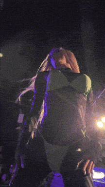 a blurred image of a person holding a sign that says ' i love you '
