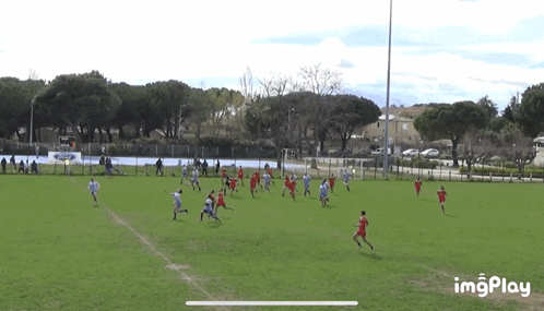 a group of people are playing soccer on a field with the words imgplay at the bottom of the screen