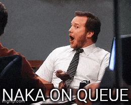 a man in a white shirt and tie is sitting at a table with the words naka-on-queue written below him