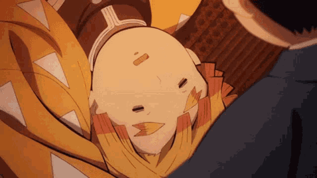 a close up of a person laying on their back with a bandage on their forehead .