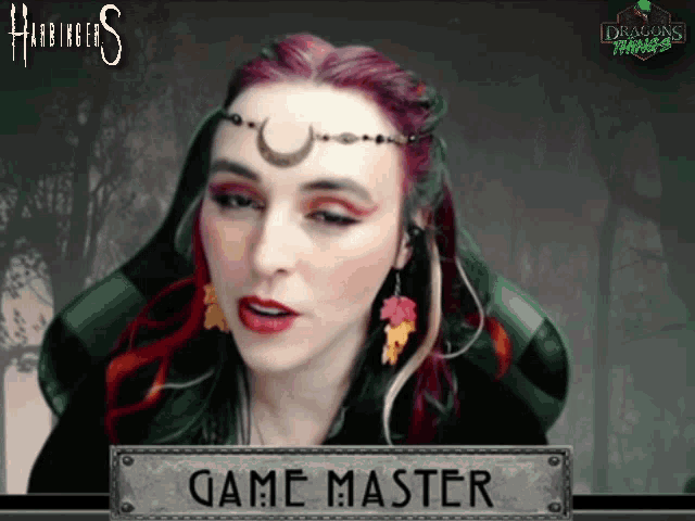 a woman with red hair is sitting in front of a sign that says " game master "