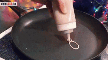 a person is pouring something into a frying pan with app.sfz.io written on the bottom