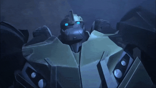 a close up of a robot with blue eyes in the dark