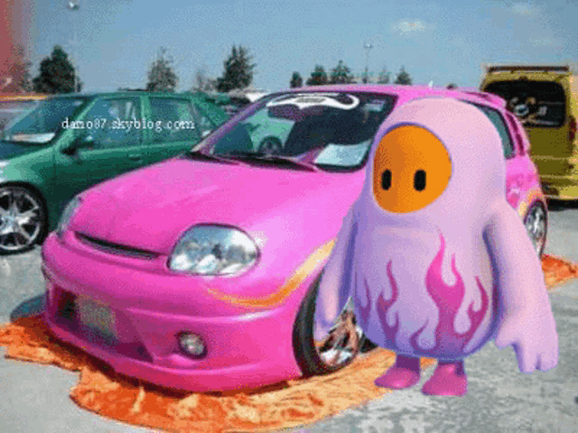 a pink car with flames painted on the front is next to a cartoon character