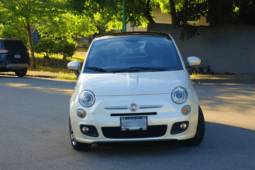 a white car with a license plate that says washington on it