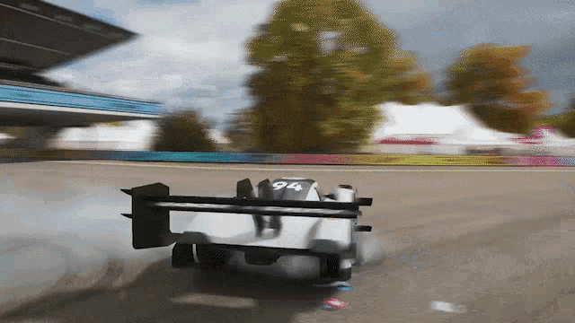 a white race car with the number 94 on the back of it