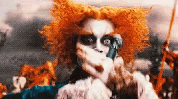 a close up of a person wearing a clown costume