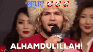 a man in a wig is speaking into a microphone with the words alhamdulillah on the bottom