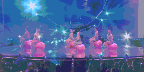 a pixelated image of a crowd watching a performance