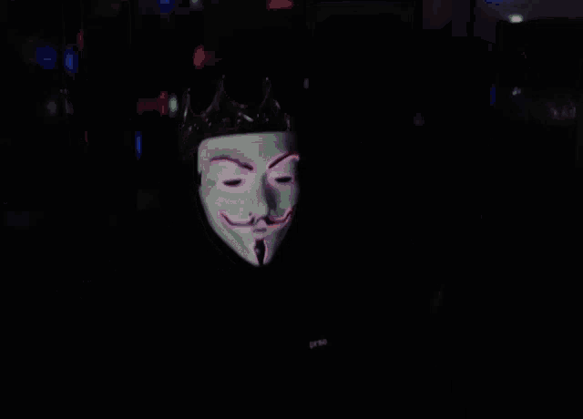 a person wearing a mask with a crown on top of it