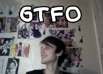 a man is smiling in front of a wall with pictures and the word gtfo on it