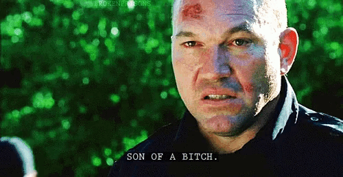 a close up of a man 's face with the words son of a bitch on the bottom