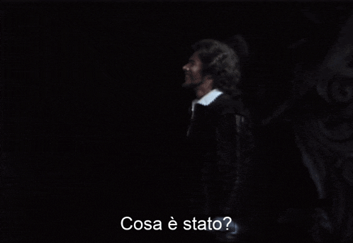 a blurry picture of a man with the words cosa e stato written below him