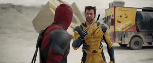 wolverine and deadpool are standing next to each other in front of a truck with a smiley face on it