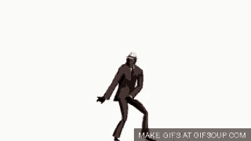 a man in a suit and tie is dancing .