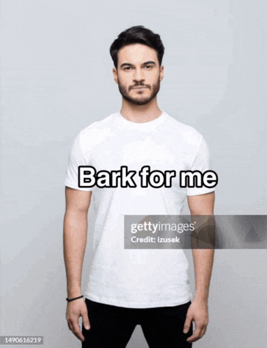a man wearing a white t-shirt that says " bark for me "