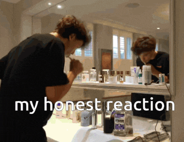 a man brushing his teeth in front of a mirror with the words my honest reaction