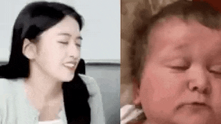 a woman is smiling next to a baby who is sleeping .