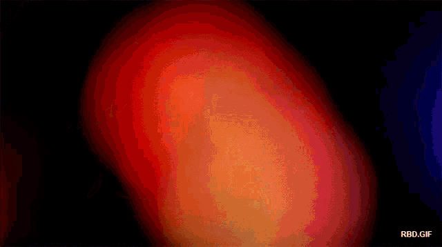 a blurry image of a red and orange colored object with the words rbd.gif below it