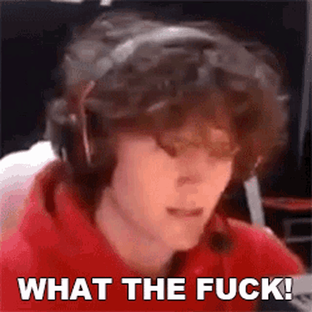 a man wearing headphones with the words what the fuck written below him