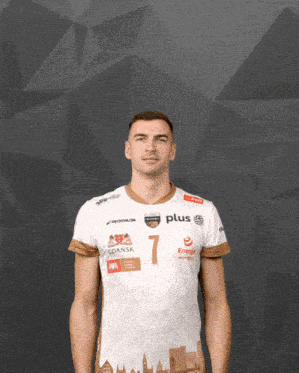 a man wearing a white shirt with the number 7 on the front