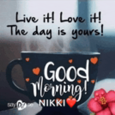 a cup of coffee with the words `` live it love it the day is yours ! ''
