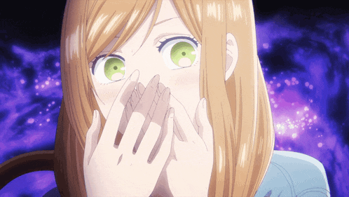 a girl with green eyes is covering her mouth with her hand