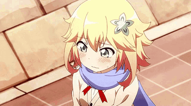 a girl with a flower in her hair wearing a scarf