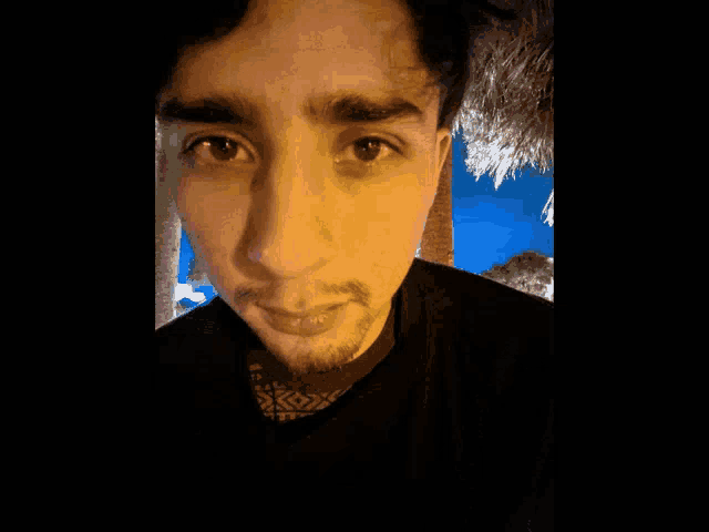 a close up of a person 's face with a beard