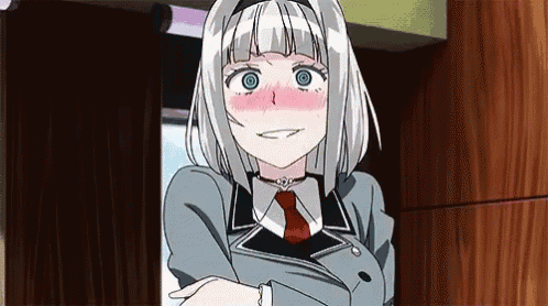 a girl with white hair and blue eyes is standing in front of a wooden door .