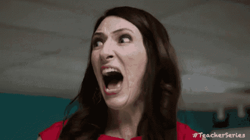 a woman in a red shirt is making a funny face with her mouth open .