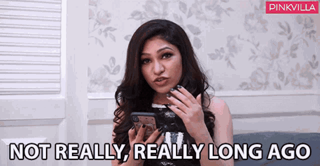 a woman holding a cell phone with the words not really really long ago