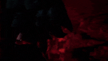 a close up of a person 's face with a glowing light behind it