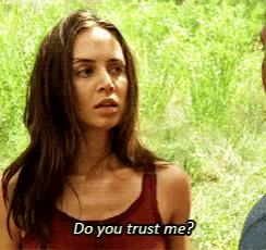 a woman in a red tank top is asking a man if he trusts her .