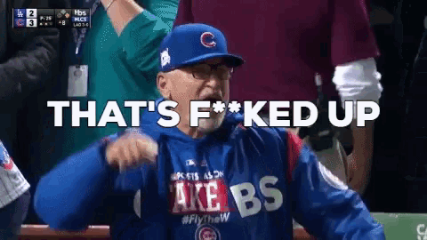 a man wearing a cubs hat and a take bs sweatshirt