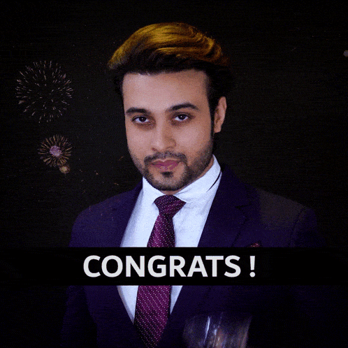 a man in a suit and tie is holding a glass of whiskey in front of fireworks and the words congrats on the bottom