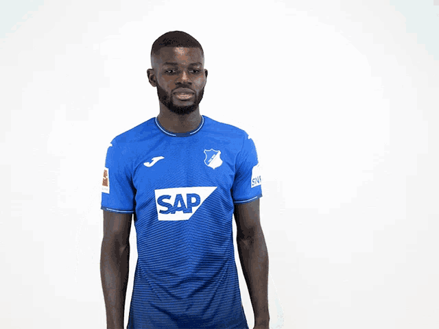 a man in a blue shirt with the word sap on the front