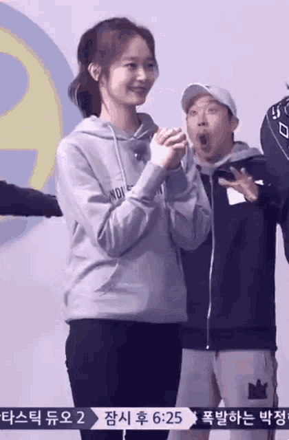 a woman wearing a hoodie that says noise