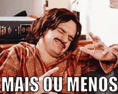 a man with a mustache is sitting on a couch with his eyes closed and the words mais ou menos below him