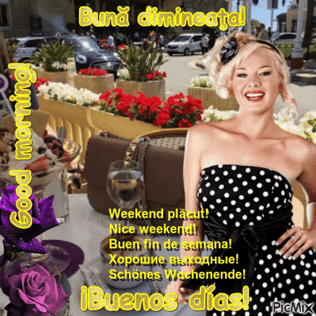 a woman in a black and white polka dot dress is holding a glass of wine and smiling