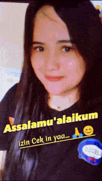 a woman is wearing a black shirt that says assalamu ' alaikum on it
