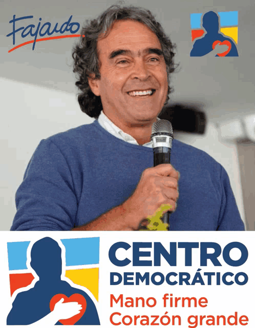 a man holding a microphone next to a centro democratico sign